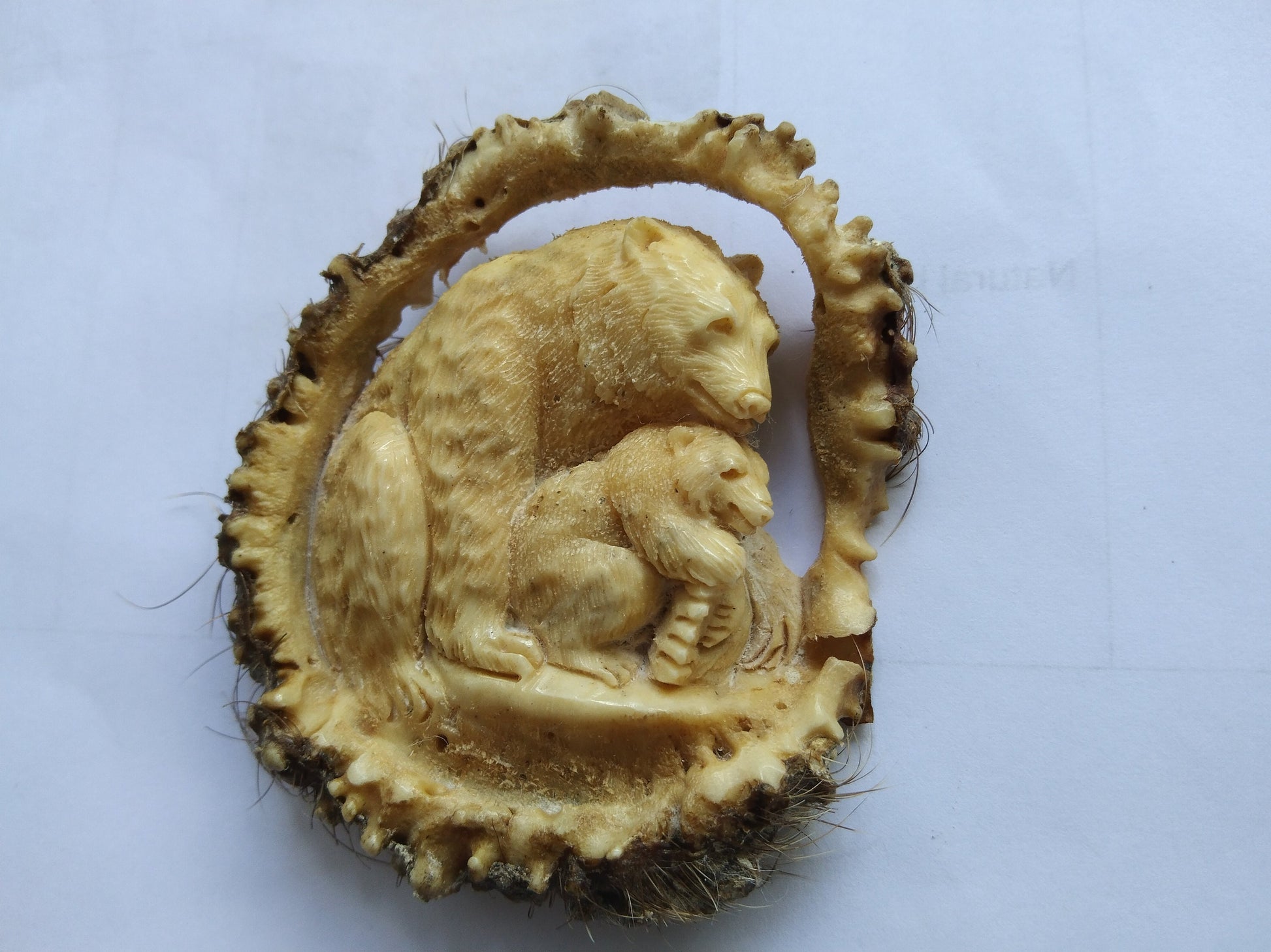 Antler carving mother bear and baby for pendant