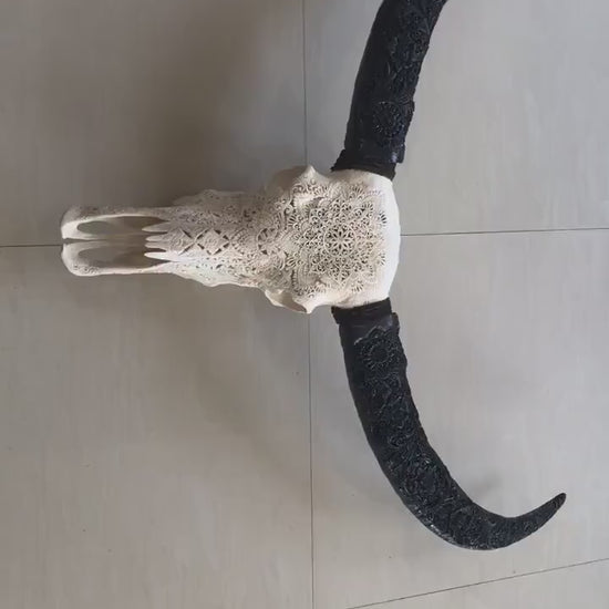 carve buffalo skull with long carved horn mandala