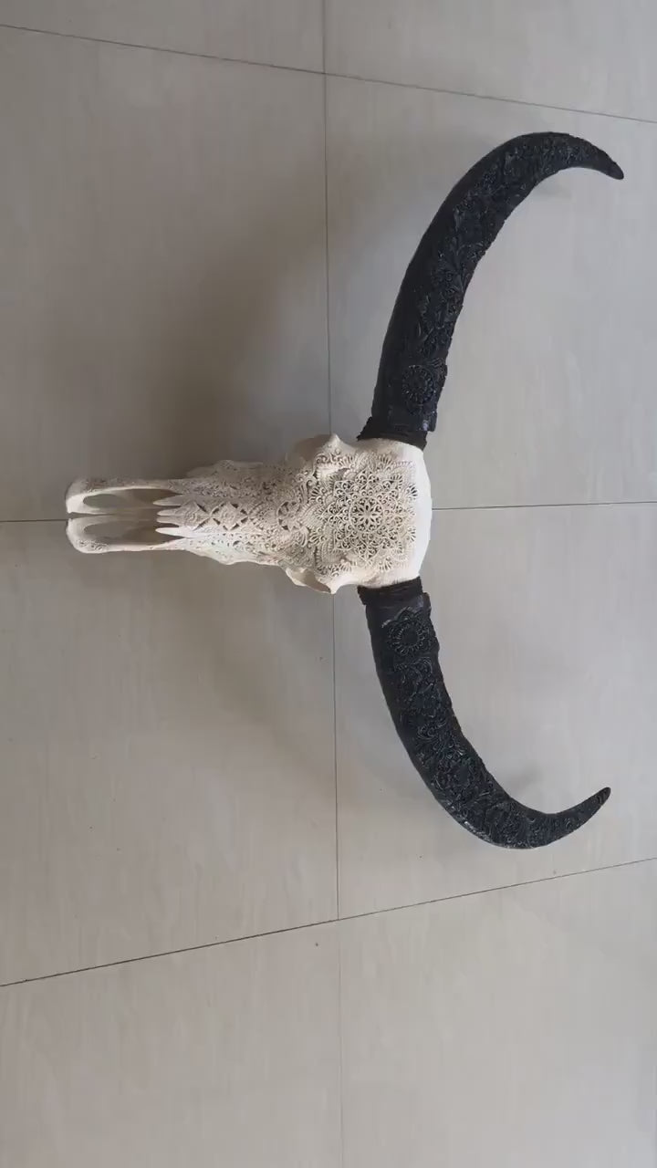 carve buffalo skull with long carved horn mandala